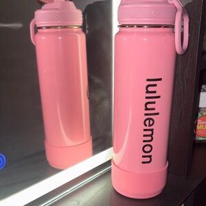 Shiny pink and gold Lululemon flip straw water bottle